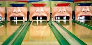A humor photo with bowling pins shown as a mouth with missing teeth.